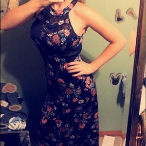 Long, flowered navy blue dress.